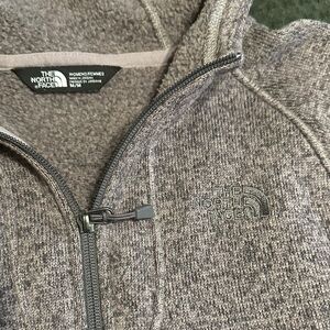 The North Face Heathered Lilac 1/4 Zip Hooded Fleece with front pocket.